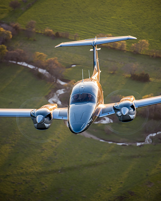 Diamond DA62 flying over field