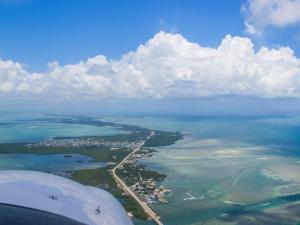 DA40 flying over coast